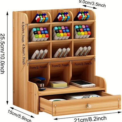 Wooden desk organizer with compartments and a drawer, displaying markers and stationery items, with dimensions indicated.