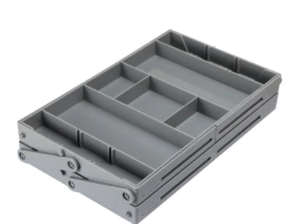 Gray plastic tray with compartments on a white background
